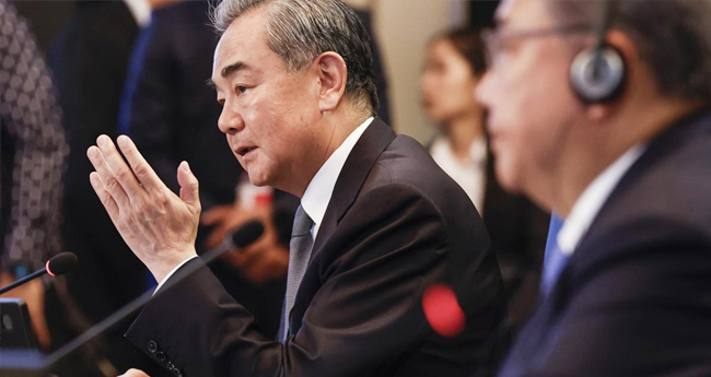 beijings-top-diplomat-wang-yi-tells-kissinger-impossible-to-contain-china